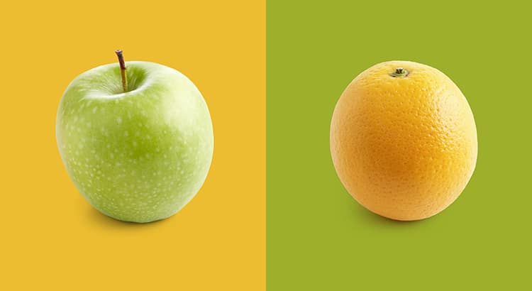 Apple and orange against yellow and green background.