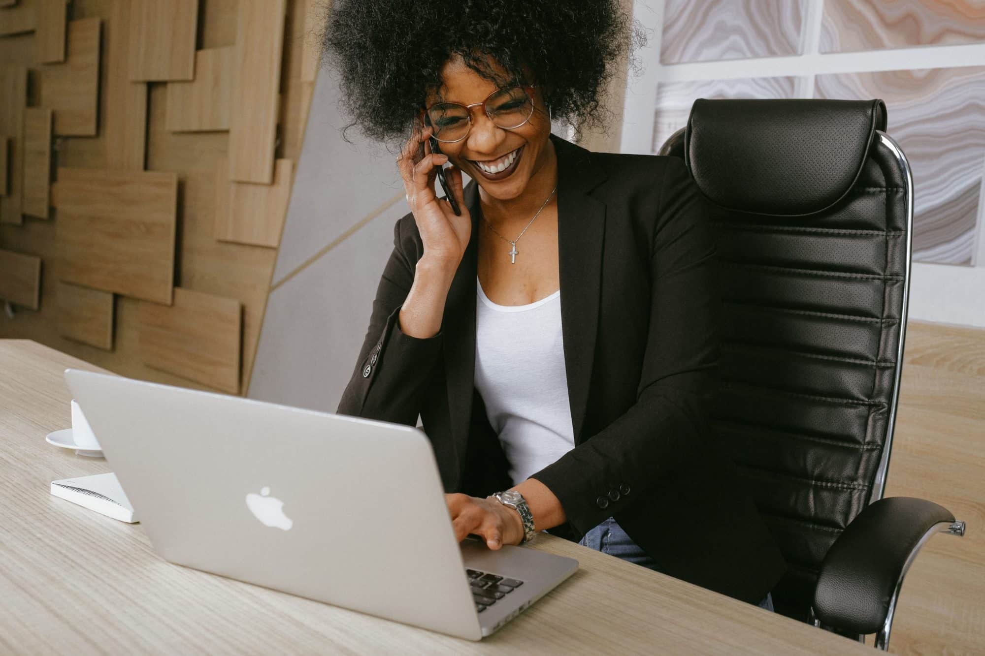 Smiling woman on a sales call creating a great customer experience.